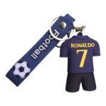 Keychain figure of Ronaldo wearing a purple jersey with the number 7, attached to a blue strap with a soccer ball graphic.