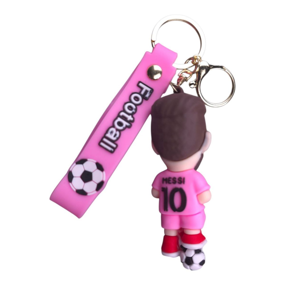 Pink football-themed keychain featuring a small Messi figurine wearing a pink kit with 'MESSI 10' on the back and a pink tag with a soccer ball illustration, attached to rings.