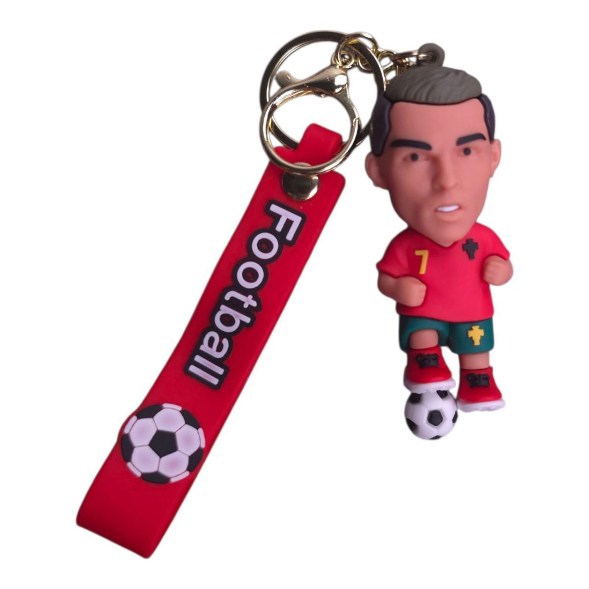 Red keychain featuring a football-themed strap with a soccer ball graphic and a small soccer player figurine attached.