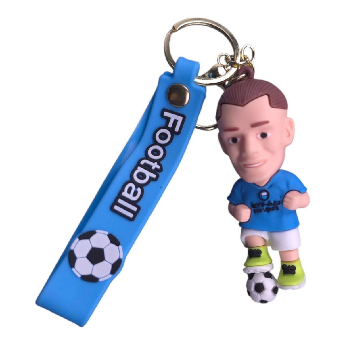 Blue keychain featuring a mini soccer player figurine standing on a small soccer ball, attached to a blue strap printed 'Football'.