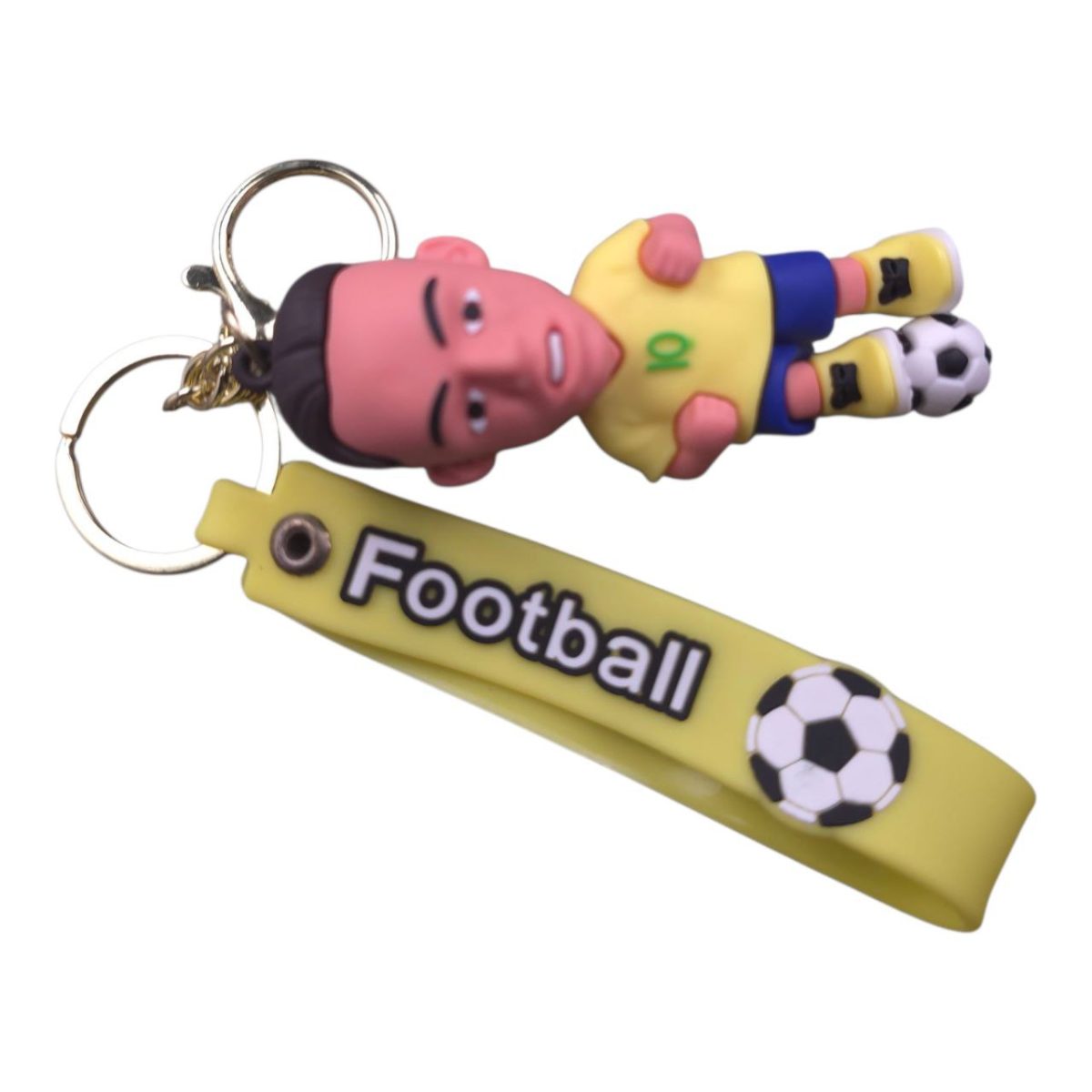Plastic footballer keychain lying on a yellow strap that reads 'Football' with a soccer ball graphic on the end, attached to a metal split ring.