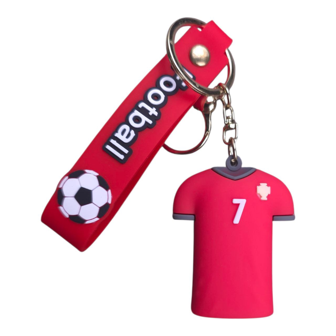 5805548633519671622 | UAE SPORT STORE Red keychain with a small pink jersey charm showing the number 7 and a hanging soccer ball motif, attached to a red strap that says 'football'.