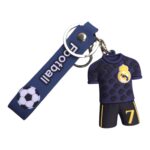 Keychain with a Real Madrid jersey charm (crest and number 7) attached to a dark blue strap with a soccer ball graphic