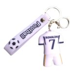 Football-themed keychain: a tiny white Ronaldo #7 jersey and a white whistle on a metal ring with a football motif.