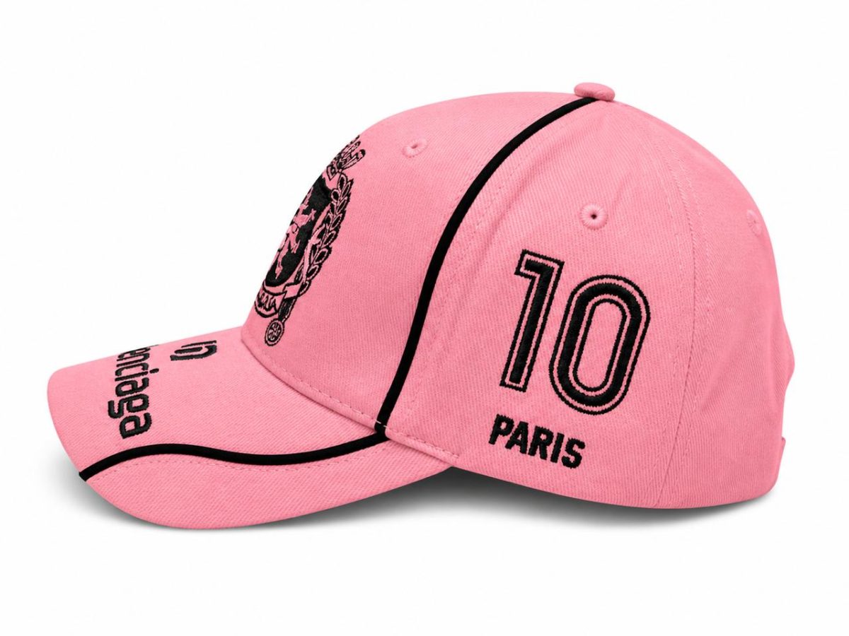 Pink baseball cap with black embroidered '10 PARIS' on the side and black piping details.