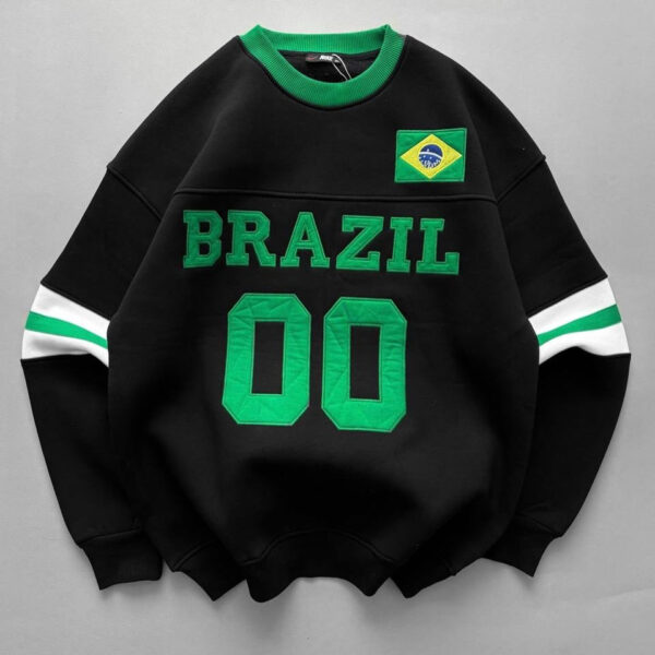 Black sweatshirt with Brazil flag patch, bold green 'BRAZIL' lettering, and green '00' on the front; green collar and striped sleeves.