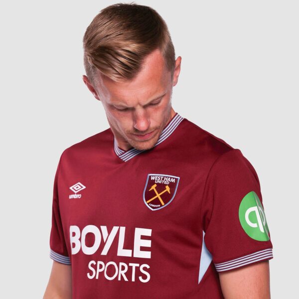 Male footballer in a West Ham United maroon jersey, looking down, displaying the club crest and Boyle Sports sponsor, with a green patch on the sleeve.
