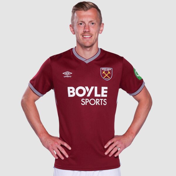 Male model wearing a maroon West Ham United football jersey with Boyle Sports sponsor, standing with hands on hips against a light background.