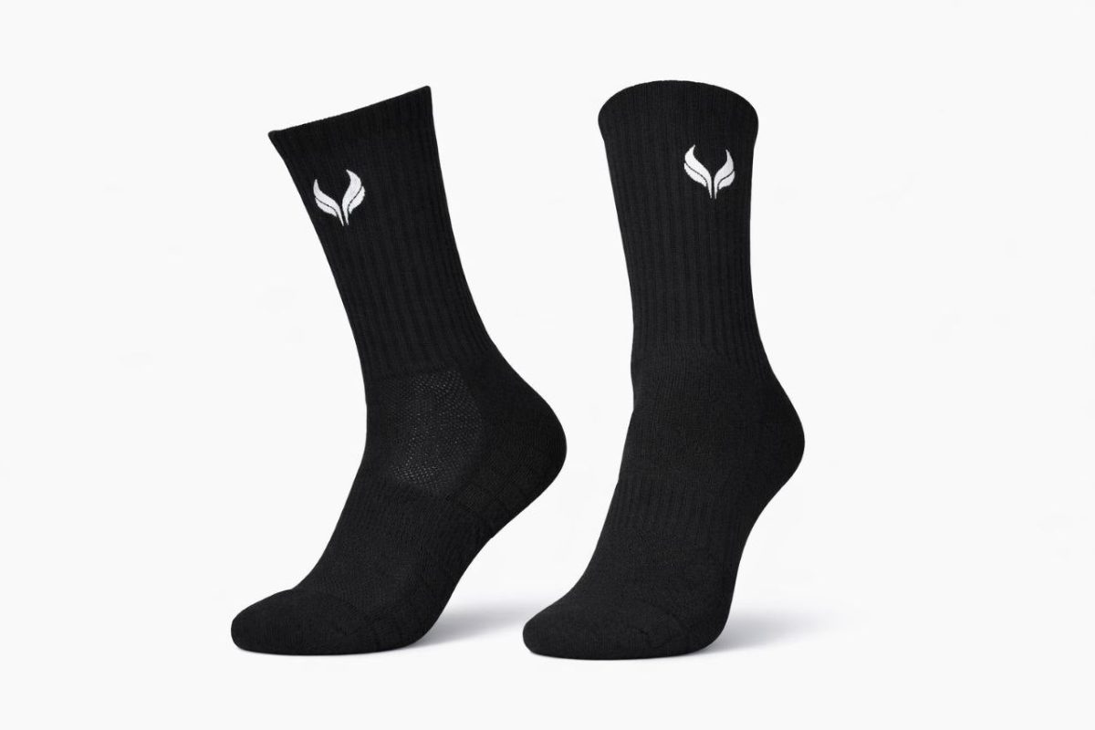 Pair of black crew socks with a white brand logo near the top, displayed on a white background.