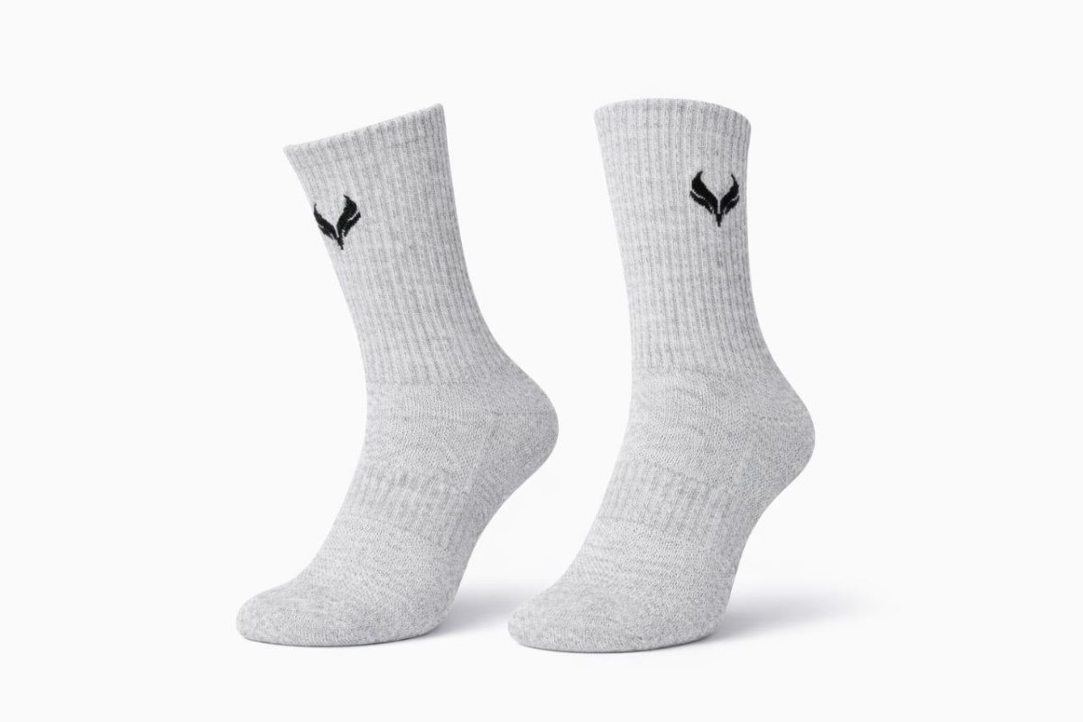 Pair of light gray ribbed socks with a small black emblem near the top, displayed side by side on a white background.