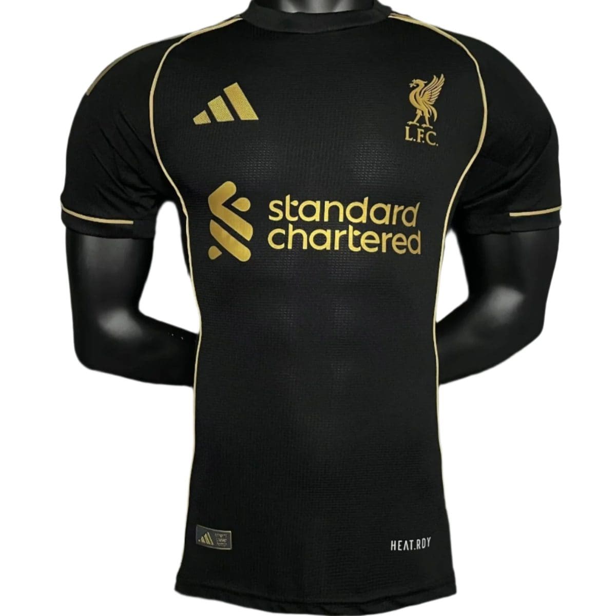 Black Liverpool FC soccer jersey in black with gold Adidas logo, Gold crest, and gold 'Standard Chartered' sponsor on the front, displayed on a mannequin torso.