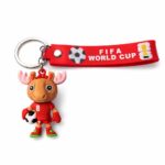 Red lanyard keychain with FIFA World Cup logo and a cartoon moose holding a soccer ball
