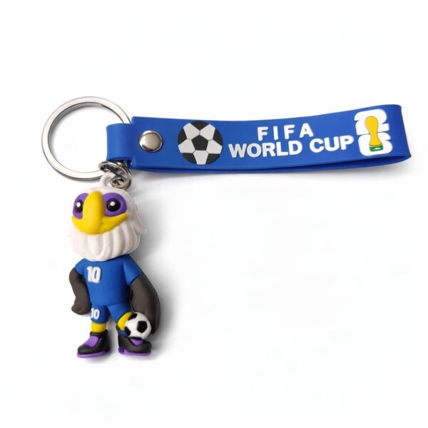 Blue FIFA World Cup lanyard with a small eagle mascot figure wearing a blue jersey and holding a soccer ball