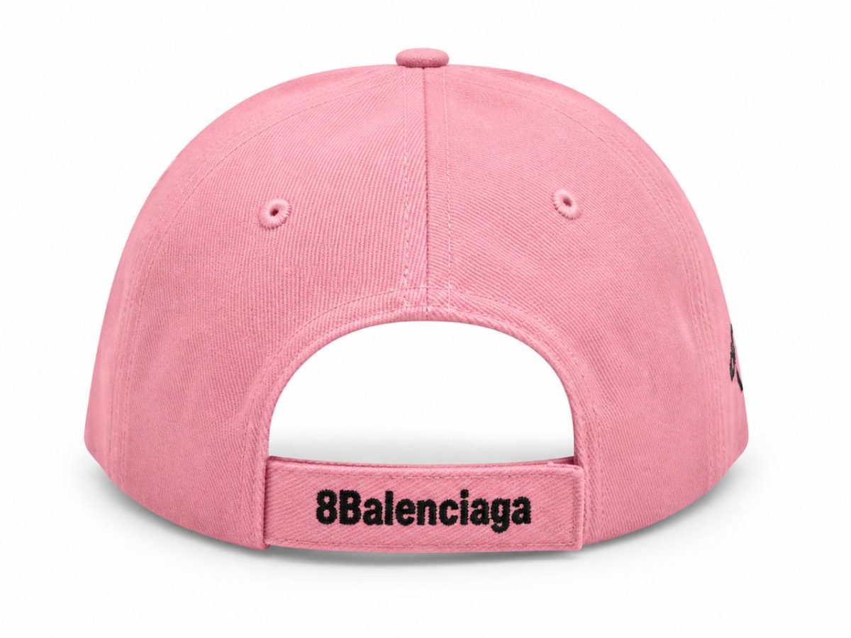 Back view of a pink baseball cap with an adjustable strap embroidered with '8Balenciaga' before the opening.