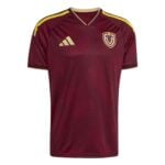 59b65273-f0b7-4ca7-8be2-050985349642 | UAE SPORT STORE Maroon Adidas soccer jersey with gold crest on the chest and yellow shoulder stripes, geometric pattern throughout