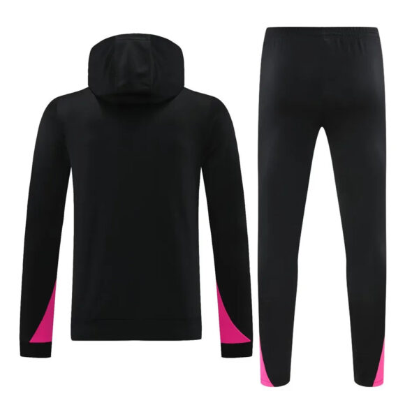 Back view of a black hoodie and matching track pants with pink panels at the cuffs and ankles.