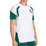 White Italy football jersey with green side panels and gold Adidas logo on chest, shown on a model