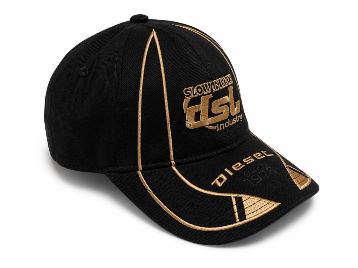 Black baseball cap with gold embroidery and curved brim, featuring front-panel branding in gold.