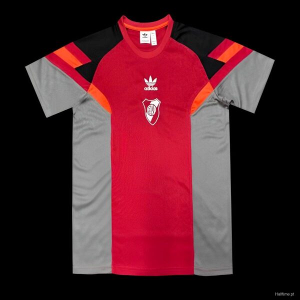 Red and gray Adidas soccer jersey with a red central panel, gray sides, and black/orange shoulder accents, featuring a white club crest on the chest.