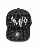 Black monogram cap with "AMIRI" logo and snake print, stylish accessory for sports and casual wear.