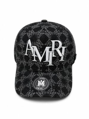 Black monogram cap with "AMIRI" logo and snake print, stylish accessory for sports and casual wear.
