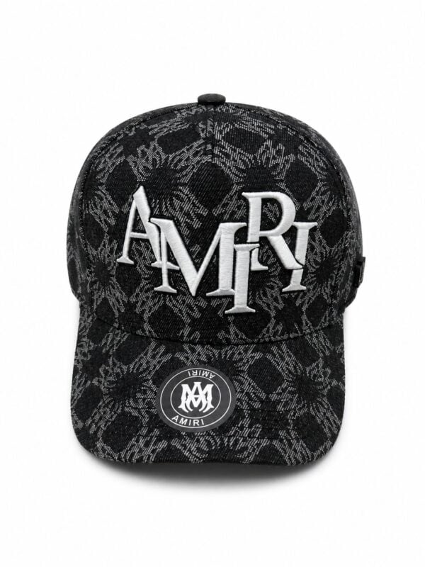 Black monogram cap with "AMIRI" logo and snake print, stylish accessory for sports and casual wear.