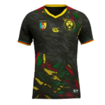 Black football jersey with a yellow-trim V-neck and multicolor abstract pattern, featuring a Cameroon-style crest and a yellow lion badge on the chest.
