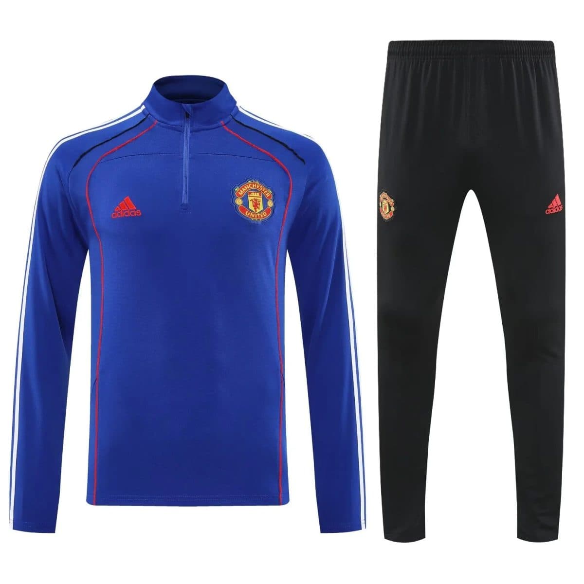 Manchester United blue training top with red piping and crest, paired with black Adidas track pants with crest.