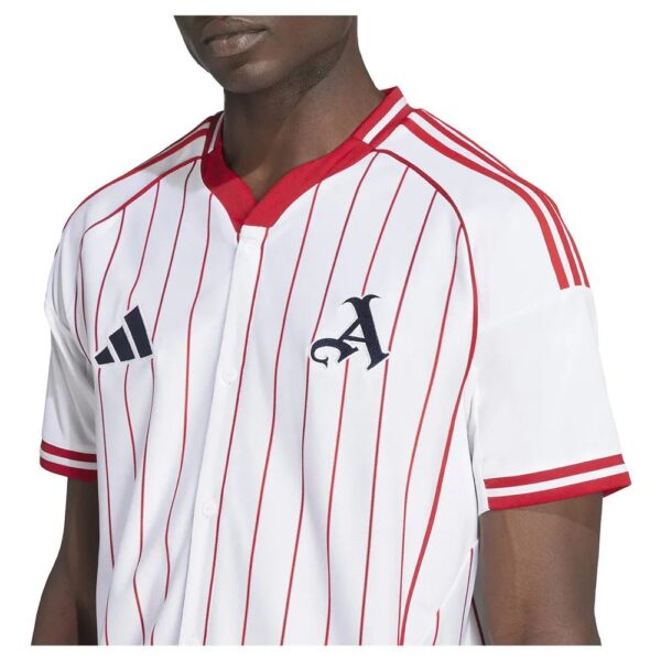 White baseball jersey with red vertical pinstripes, red collar, and Adidas logo on the left chest. A navy A emblem appears on the right chest.
