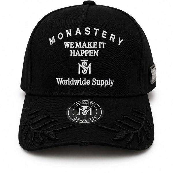 Black baseball cap with white embroidered text reading 'MONASTERY WE MAKE IT HAPPEN Worldwide Supply' and a circular logo on the brim patch.