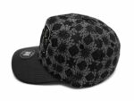 Black monogram patterned cap with curved brim and adjustable strap, perfect for sports and casual ou.