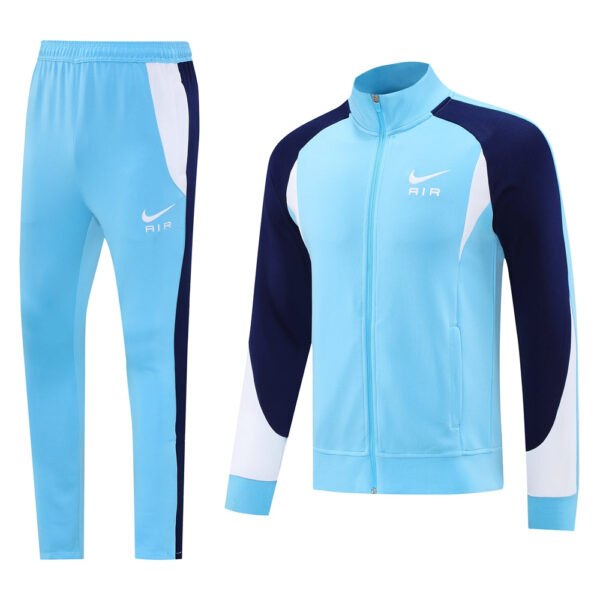 Light blue Nike Air tracksuit with navy and white panels, including a zip jacket and matching pants.