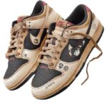 Pair of tan and black Nike sneakers with beige laces and a chunky sole, featuring graphic patches and multiple logos on the panels.