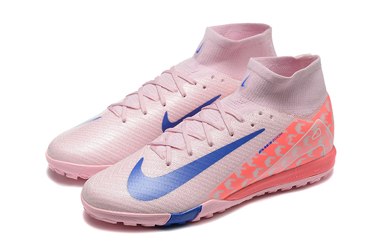 5f99d52f | UAE SPORT STORE Pink Nike football boots with blue swoosh and knitted sock collar, side view showing patterned heel and pink sole plates
