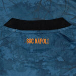 5n | UAE SPORT STORE Blue athletic jersey neckline with orange 'SSC NAPOLI' lettering visible near the collar.