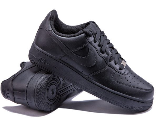 Black Nike Air Force sneakers, laces tied, side view.