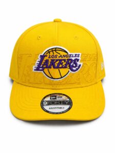 Yellow Los Angeles Lakers baseball cap with prominent purple Lakers logo embroidered on the front and a sticker on the bill.