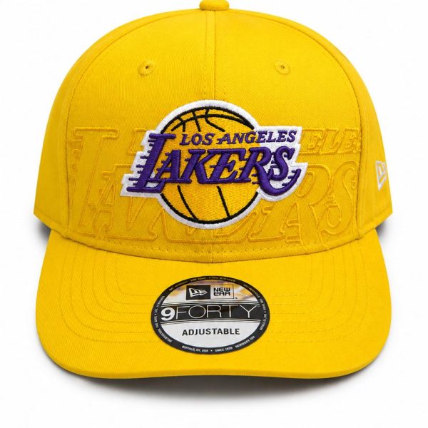 Yellow Los Angeles Lakers baseball cap with prominent purple Lakers logo embroidered on the front and a sticker on the bill.