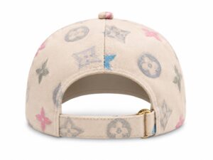 Beige baseball cap with pastel Louis Vuitton monogram pattern, viewed from the back showing an adjustable strap and gold buckle