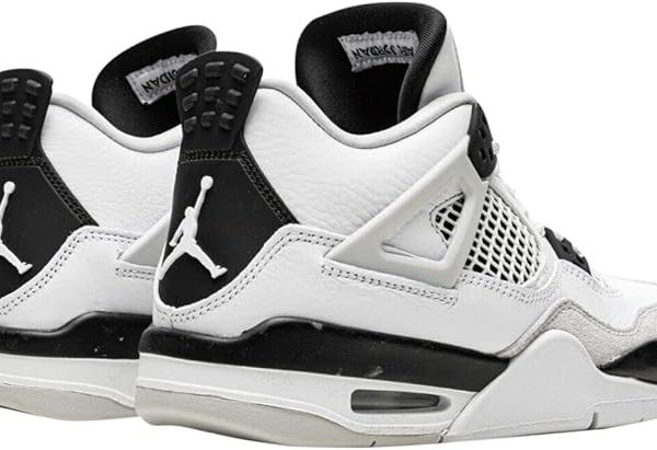 Back view of white and black Air Jordan sneakers with Jumpman logo on the heel.