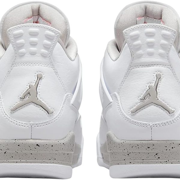 Rear view of two white Air Jordan sneakers with light gray speckled midsoles and Jumpman logos on the heels.