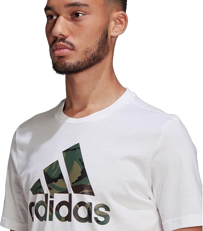 61VmZ5Zg0uL._AC_SX679 | UAE SPORT STORE Male model wearing a white Adidas T-shirt with camo Trefoil logo on the chest.