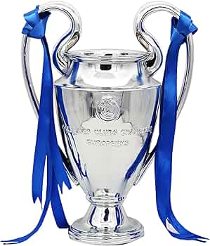 Silver trophy cup with blue ribbons draped from its handles on a white background.