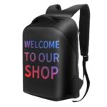 Black backpack with a front LED display showing 'WELCOME TO OUR SHOP' in multicolored letters.