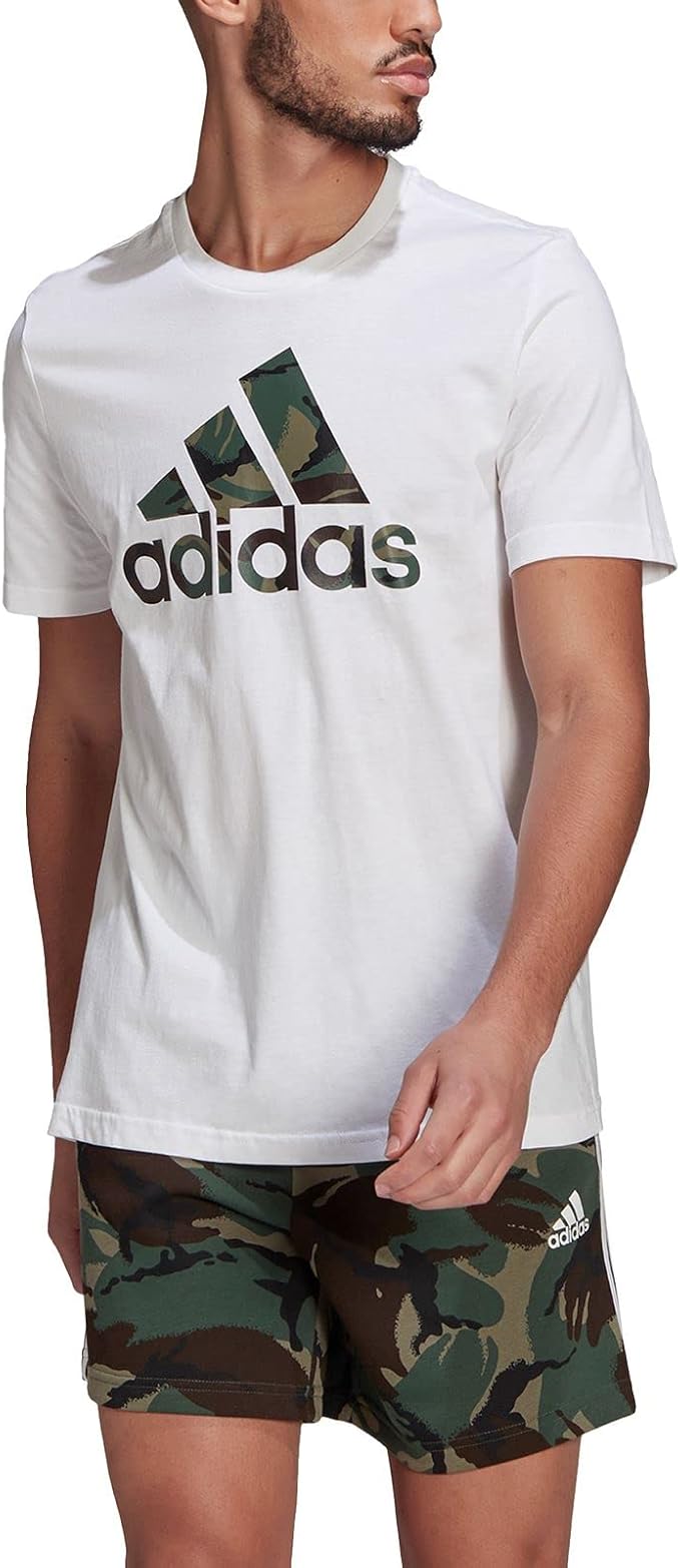 61mAYe8-XhL._AC_SX679 | UAE SPORT STORE Man wearing a white Adidas t-shirt with a large camouflage logo, paired with camo shorts.
