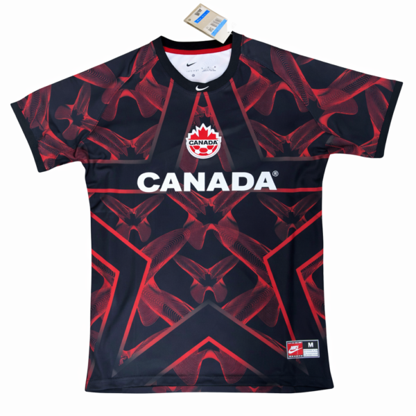 Dark navy Canada jersey with red geometric pattern, CANADA text across chest, and team crest at center front.