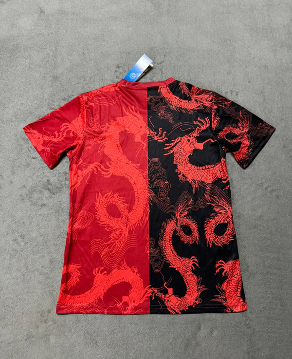 62D78E5D-8ABE-43B3-B81F-8E9623B9B78A | UAE SPORT STORE T-shirt with a red and black split design featuring red dragon motifs and a tag attached at the collar.