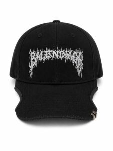 Black baseball cap with a white jagged-letter embroidery across the front.