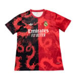 6355C8F4-491F-4D97-A15B-104F4A85F41B | UAE SPORT STORE Red and black Real Madrid football jersey with a dragon pattern, featuring the Emirates Fly Better sponsor and Real Madrid crest.
