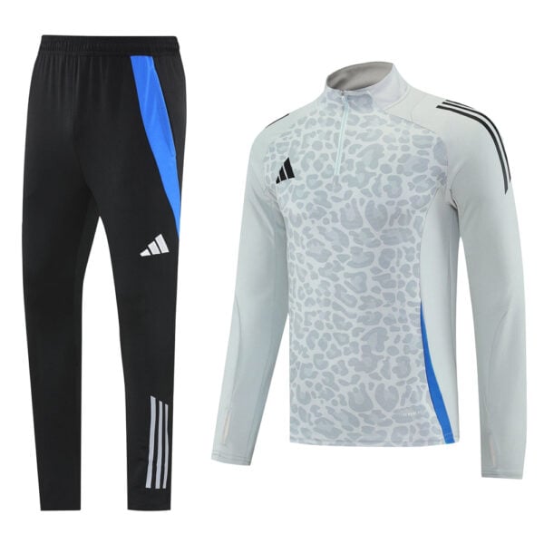 Adidas black track pants with blue side stripe and white stripes at the ankle paired with a light gray leopard-print training top with blue side panel.
